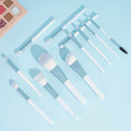 12 blue and white makeup brushes